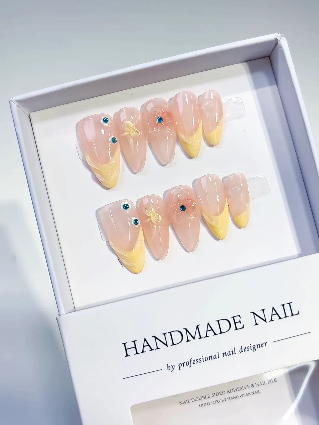 Nude Yellow French tip Flower Rhinestone press on nails angled view