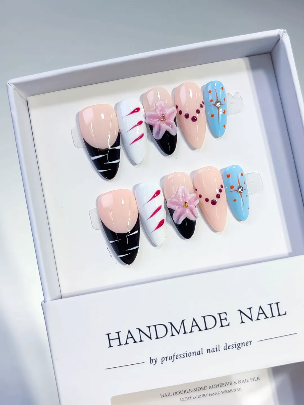 Nude Black Blue Pink Abstract Flower Bead press on nails angled view