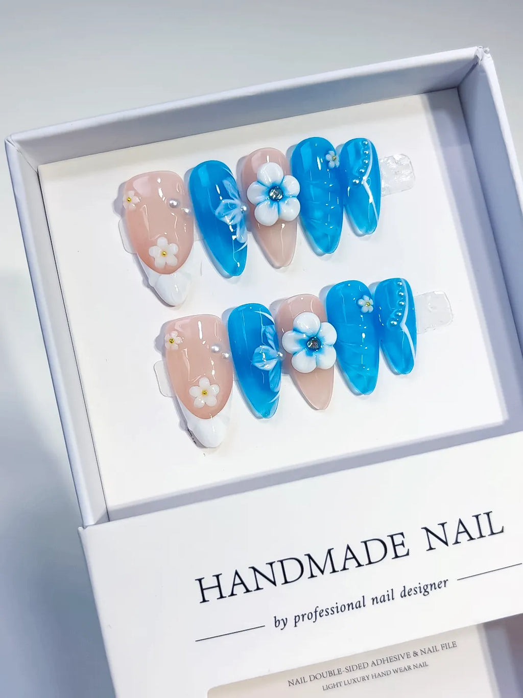 Blue Nude White Floral Flower press on nails angled view