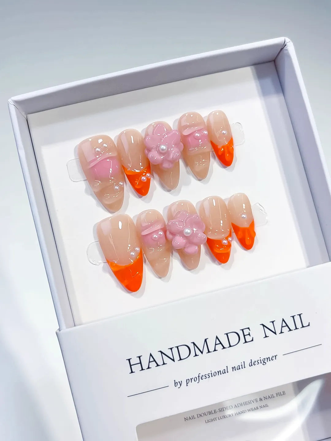 Nude Orange Pink French tip Flower Pearl press on nails angled view
