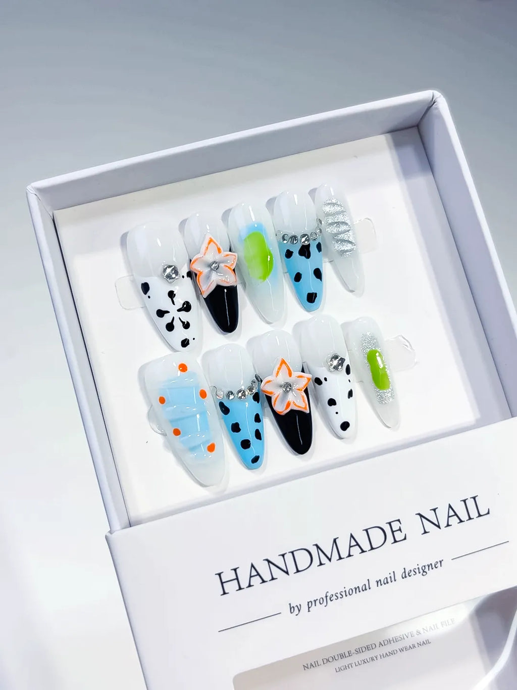 White Blue Black Green Abstract Flower Dot Pattern Rhinestone press on nails angled view