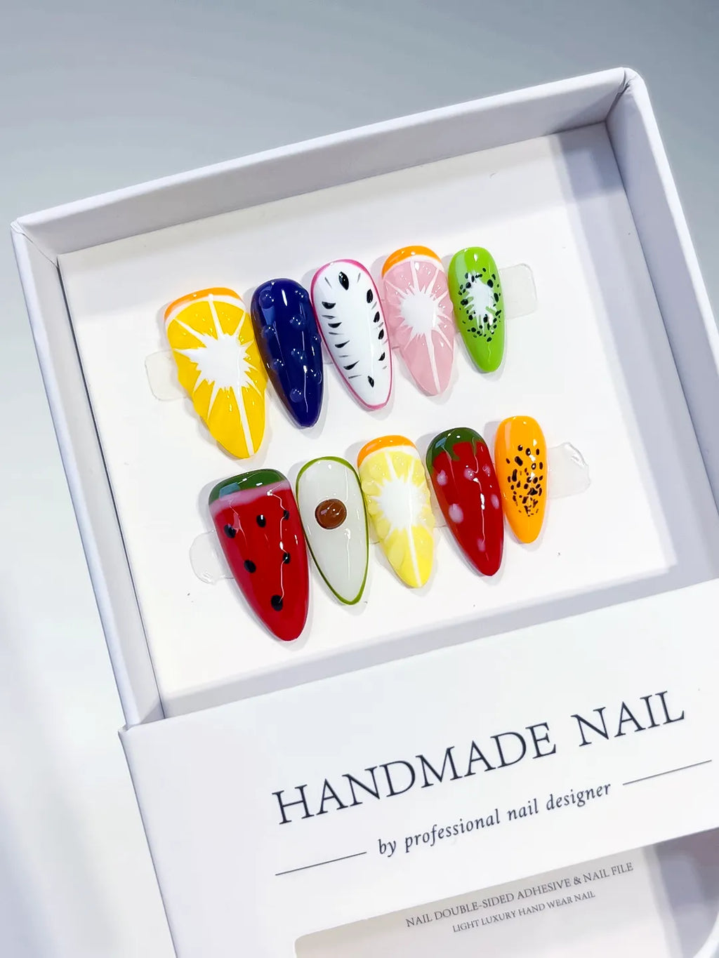 Yellow Red Green Orange Pink Abstract Fruit press on nails angled view