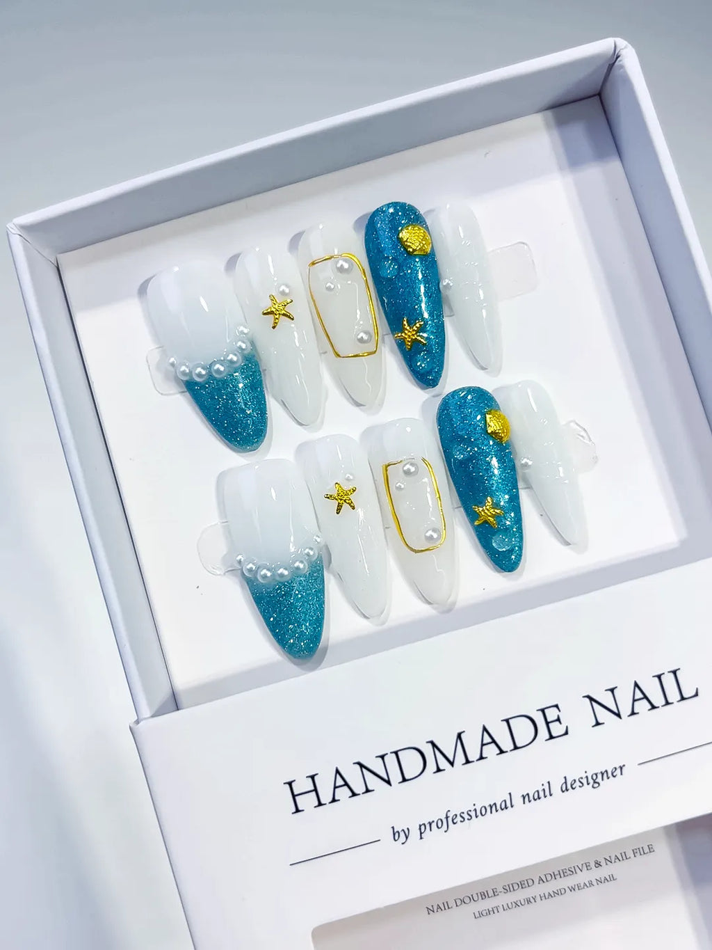 Blue White Gold Glitter Starfish Shell Pearl press on nails angled view