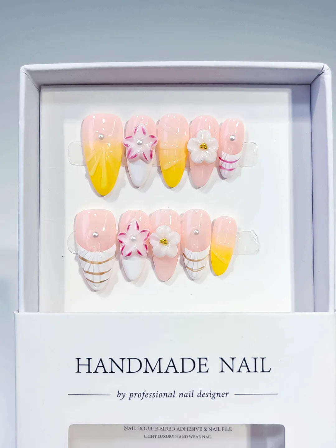Pink White Yellow French tip Flower Line Art press on nails angled view