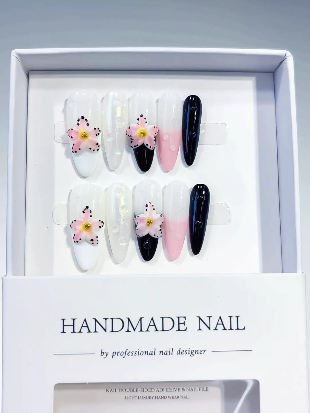 White Pink Black Abstract Flower press on nails angled view