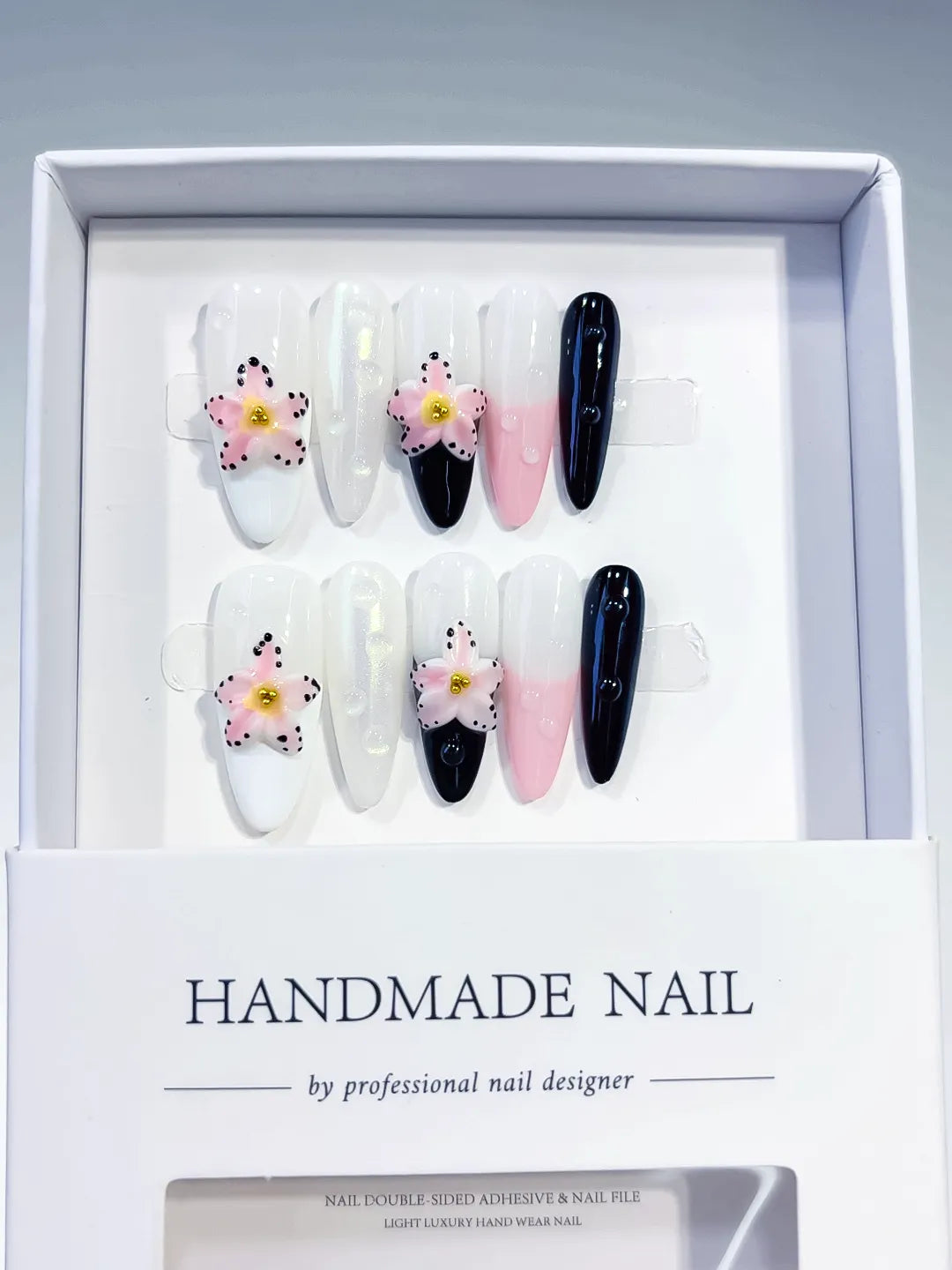 White Pink Black Abstract Flower press on nails angled view