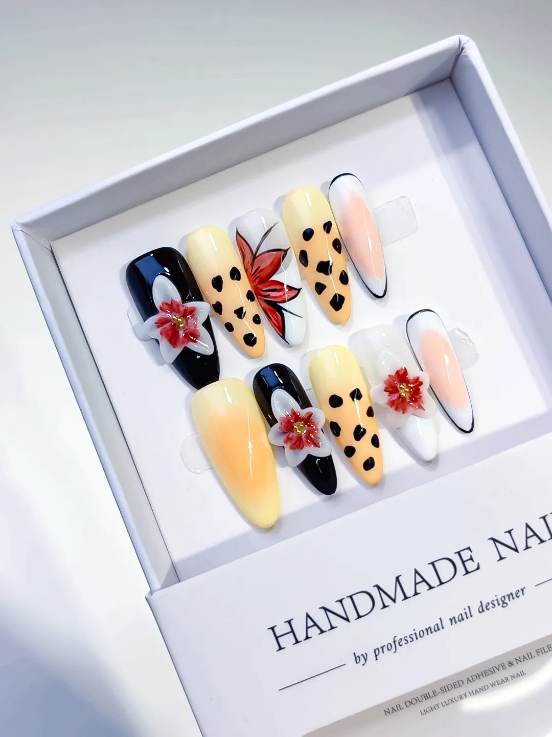 Black Yellow White Red Abstract Flower Animal Print press on nails angled view