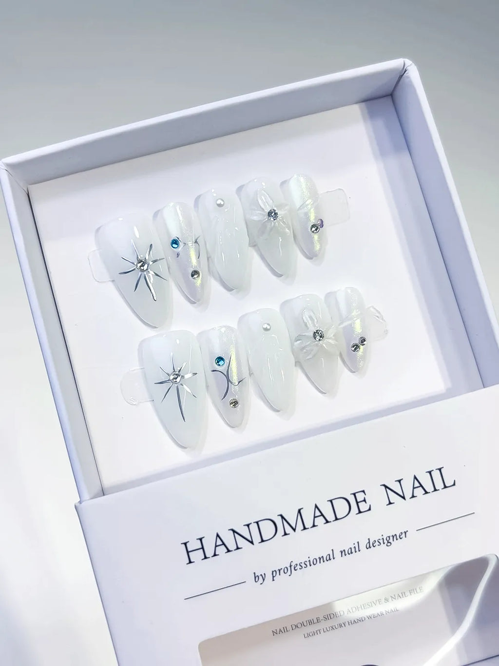 White Holographic Bow Star Rhinestone press on nails angled view
