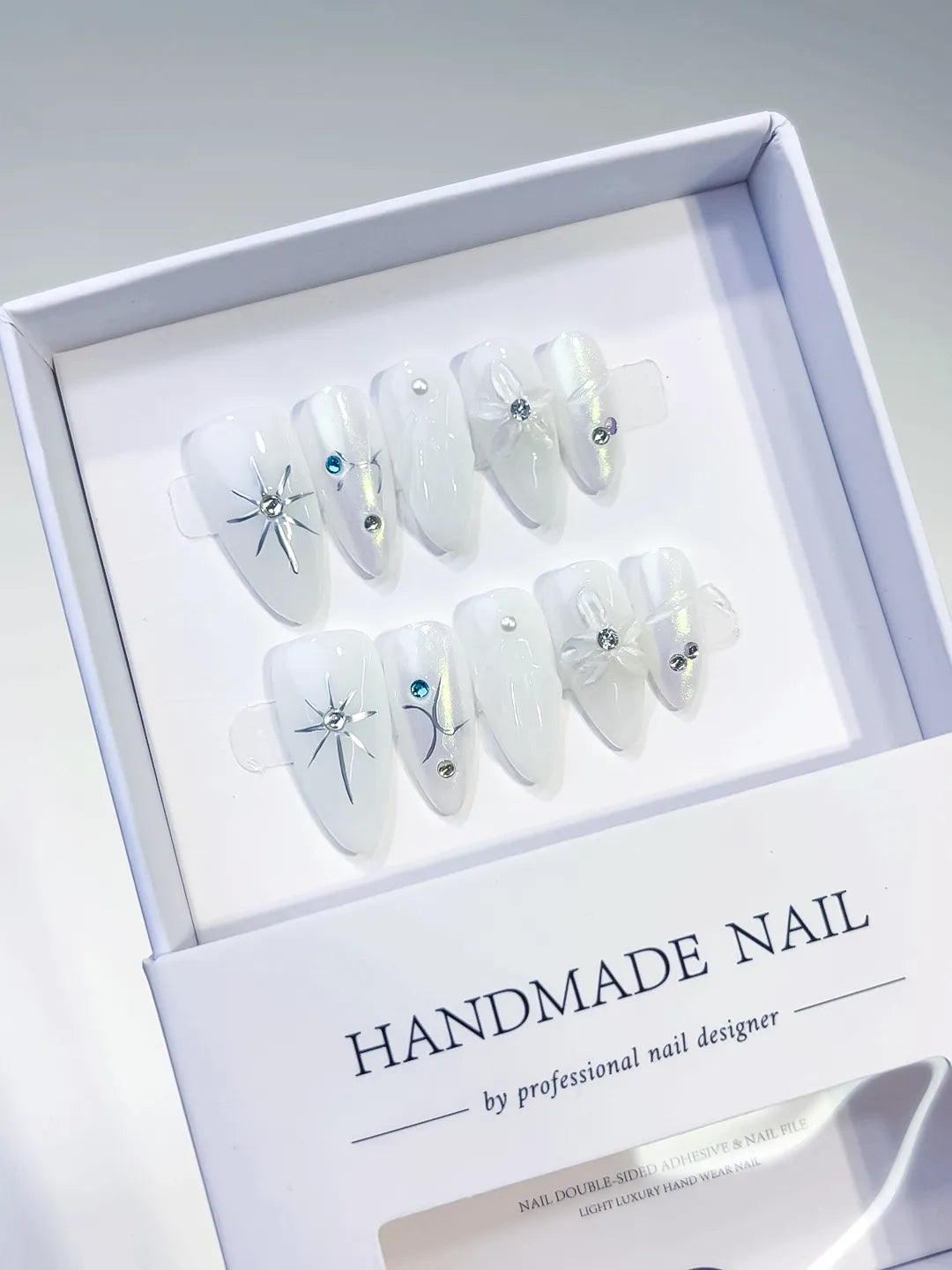 White Holographic Bow Star Rhinestone press on nails angled view