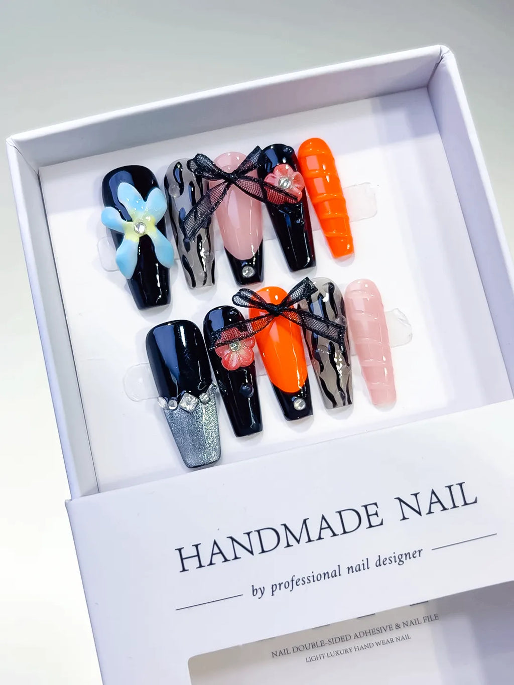 Black Orange Pink Silver Abstract Bow Flower Lace press on nails angled view