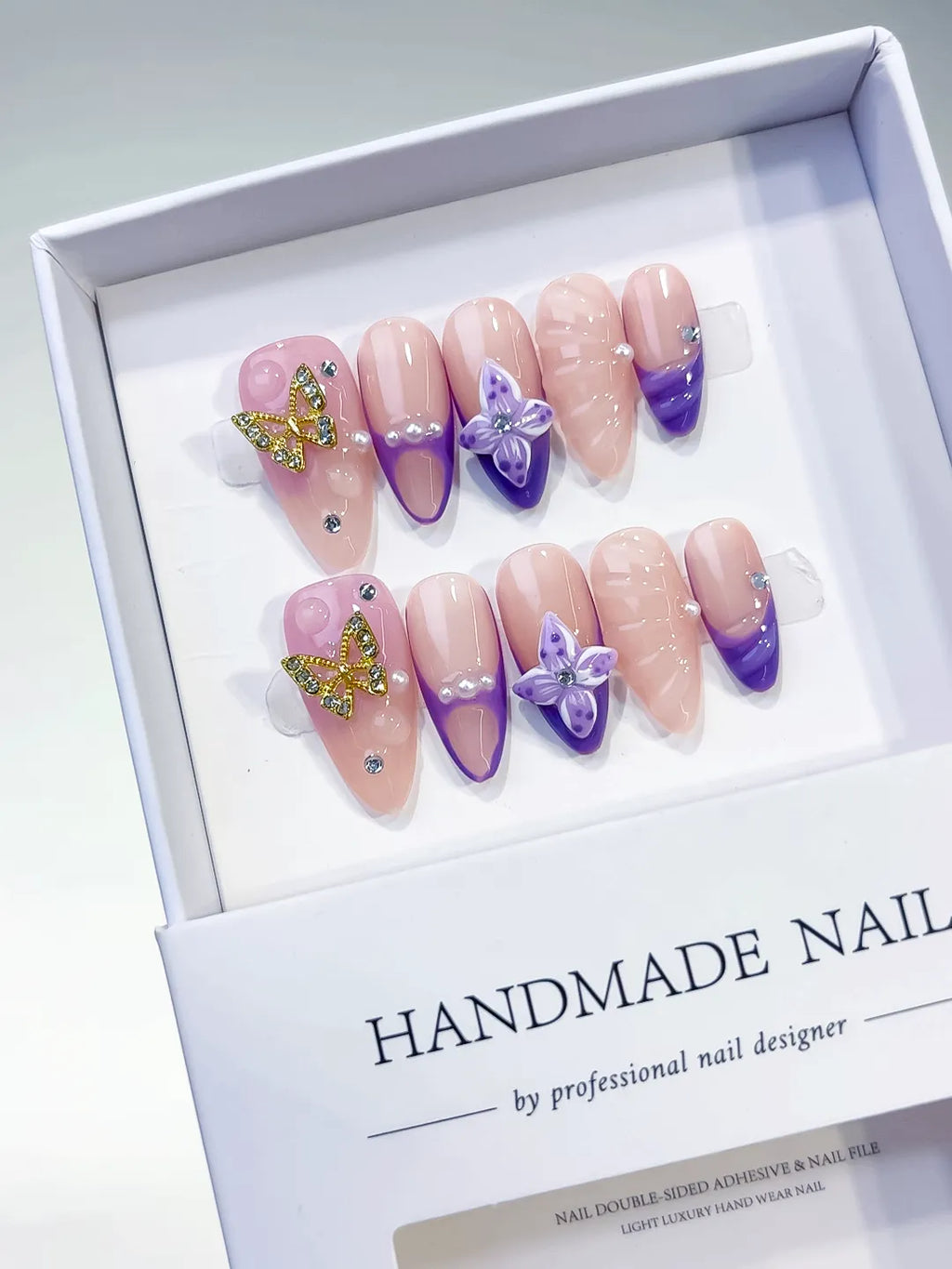 Nude Purple Gold French tip Butterfly Rhinestone press on nails angled view