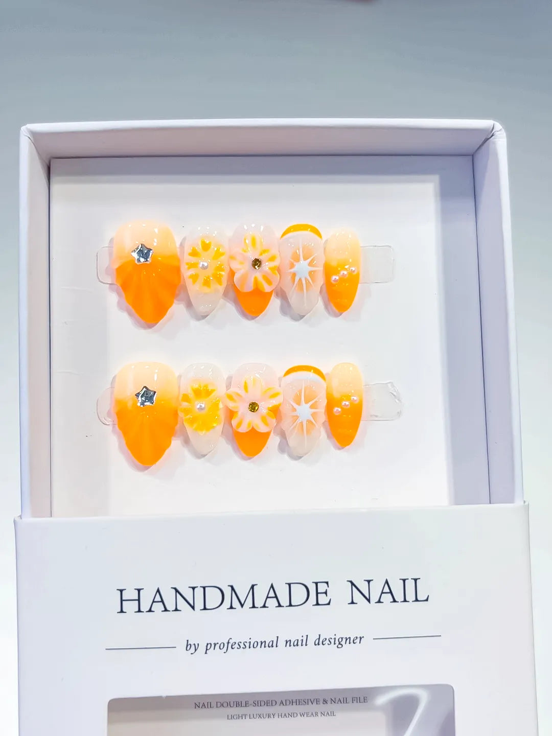 Orange White Floral Flower press on nails angled view