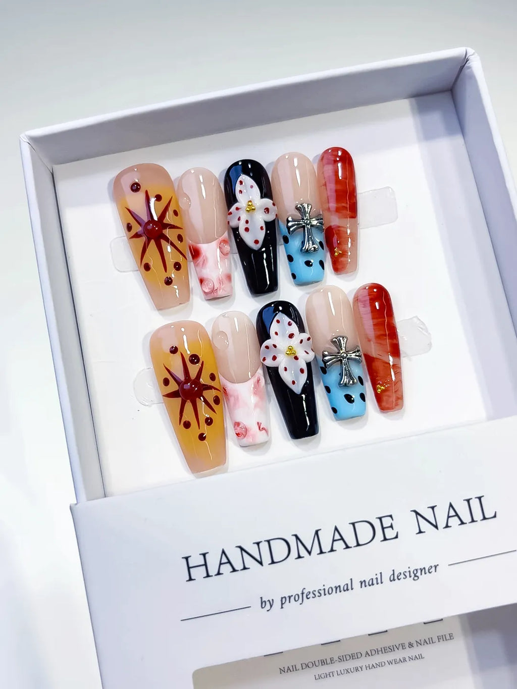 Nude Black Blue Orange Abstract Flower Cross press on nails detail view