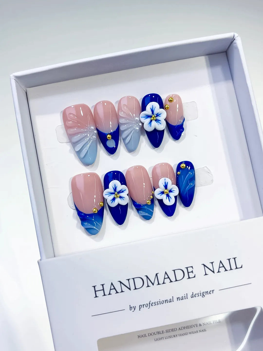Nude Blue French tip Flower Metallic press on nails angled view