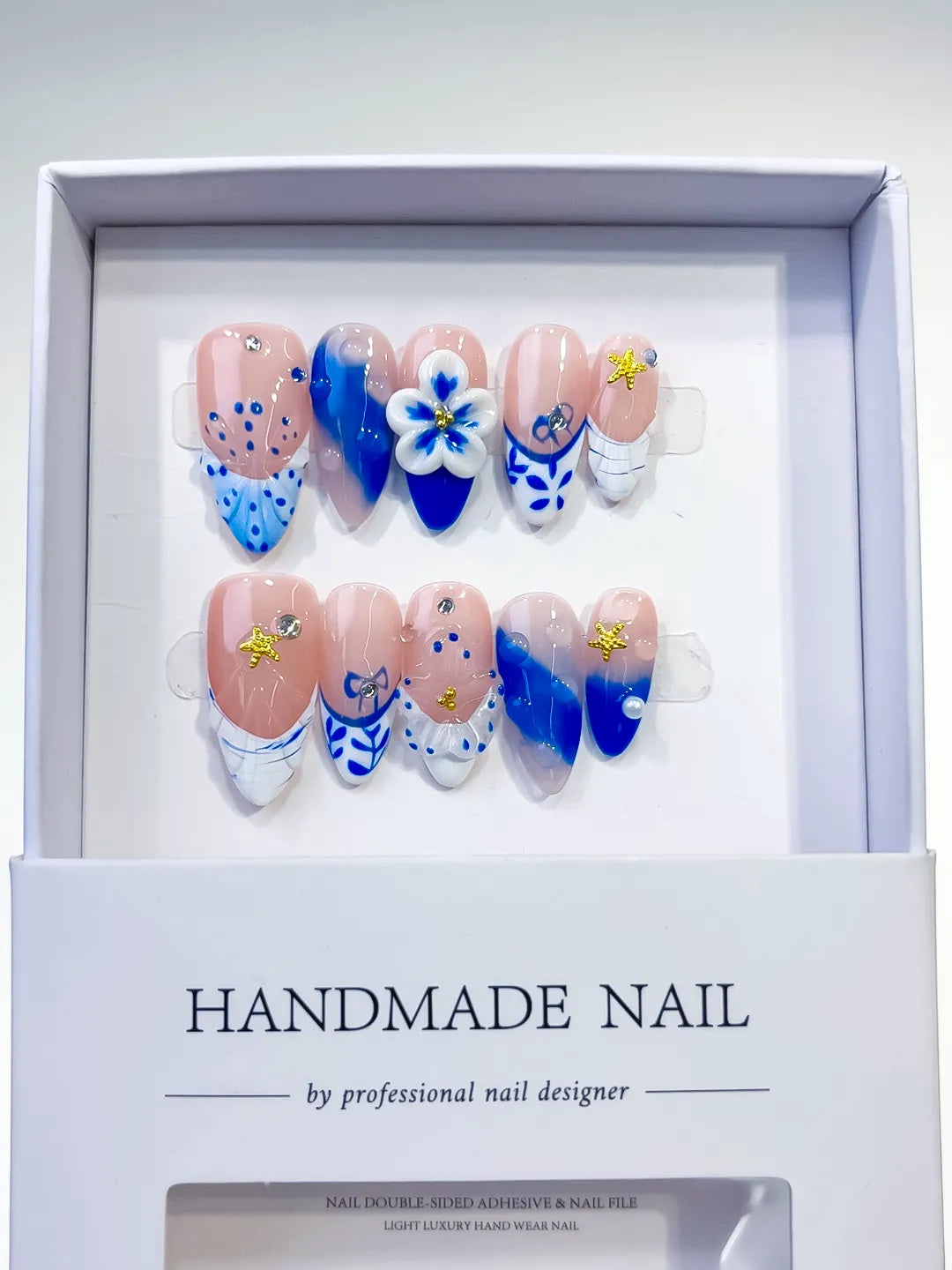 Nude Blue White French tip Flower Star press on nails angled view