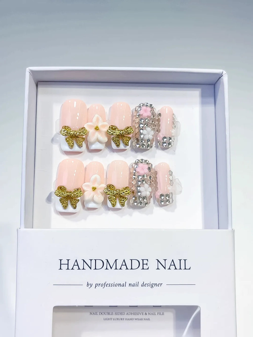 Nude Gold White Glitter Bow Flower Rhinestone press on nails angled view