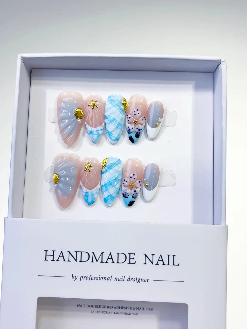 Nude White Blue Abstract Flower Shell Starfish press on nails angled view