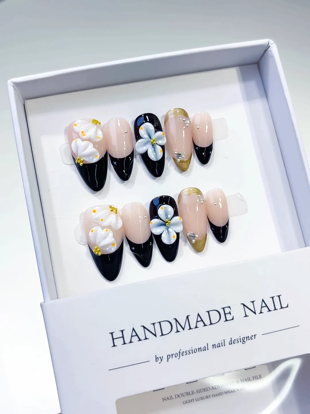 Nude Black White Gold French tip Flower Rhinestone press on nails angled view