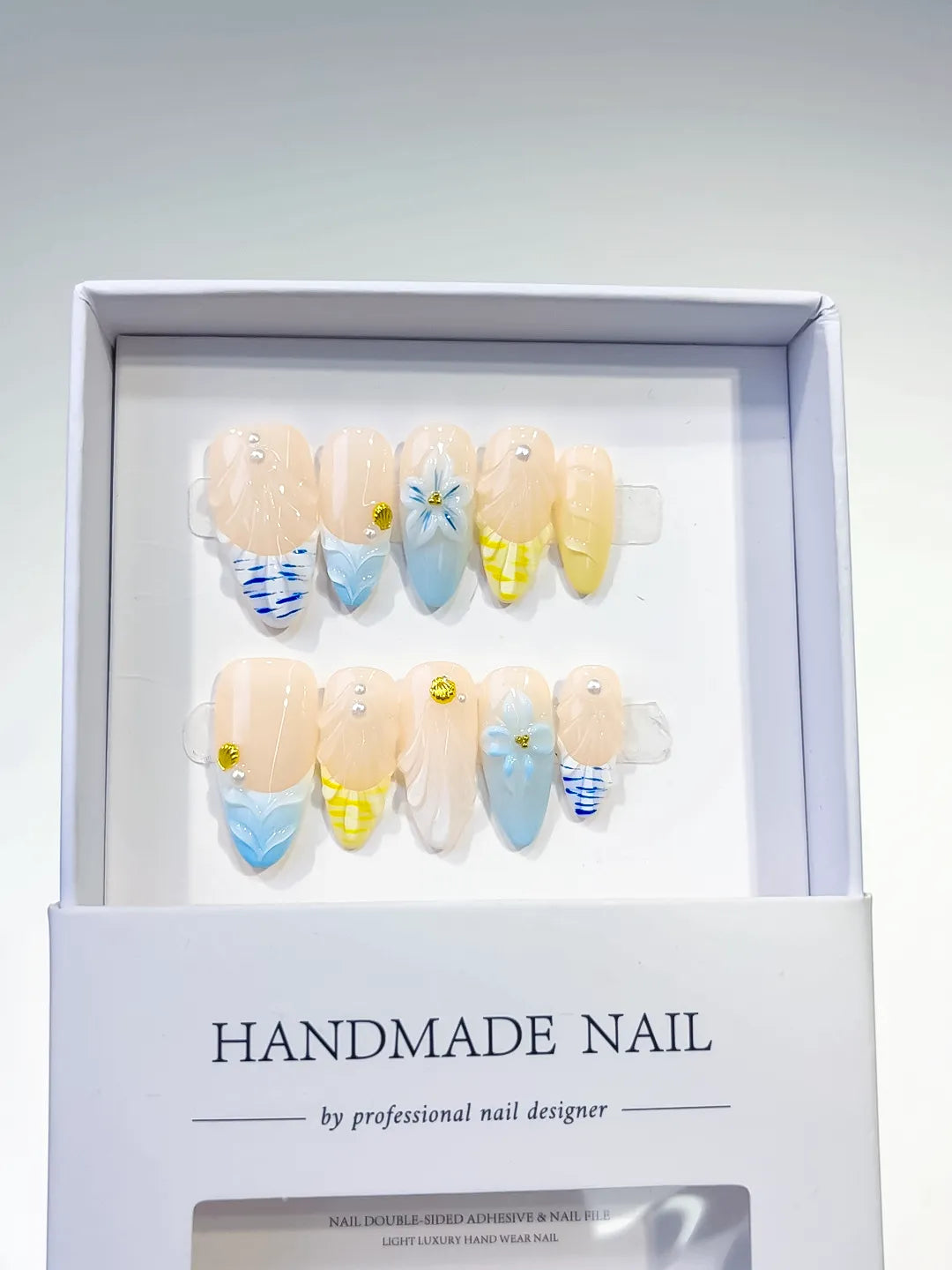Nude Blue Yellow French tip Flower Grid Pattern press on nails angled view