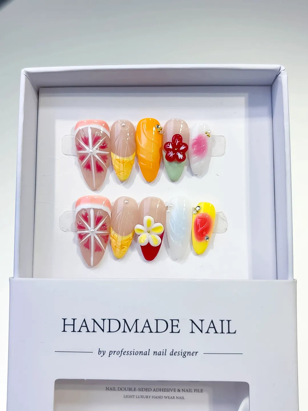 Nude Orange Pink Yellow Blue Abstract Flower Citrus press on nails angled view