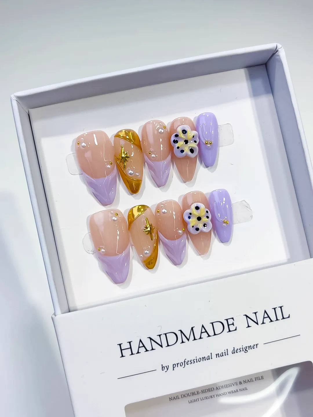 Nude Gold Purple French tip Flower Star press on nails angled view