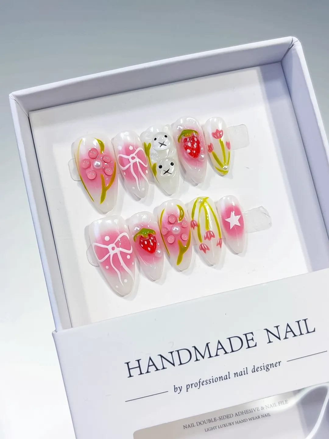 White Pink Abstract Strawberry Bow Tulip Star press on nails angled view