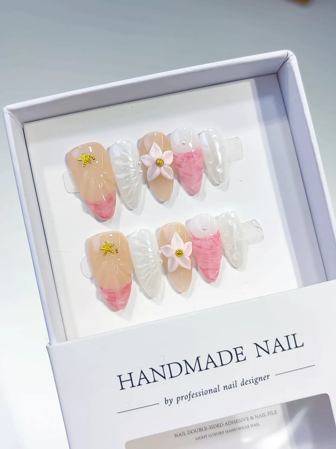 Nude Pink White Abstract Flower Star press on nails angled view