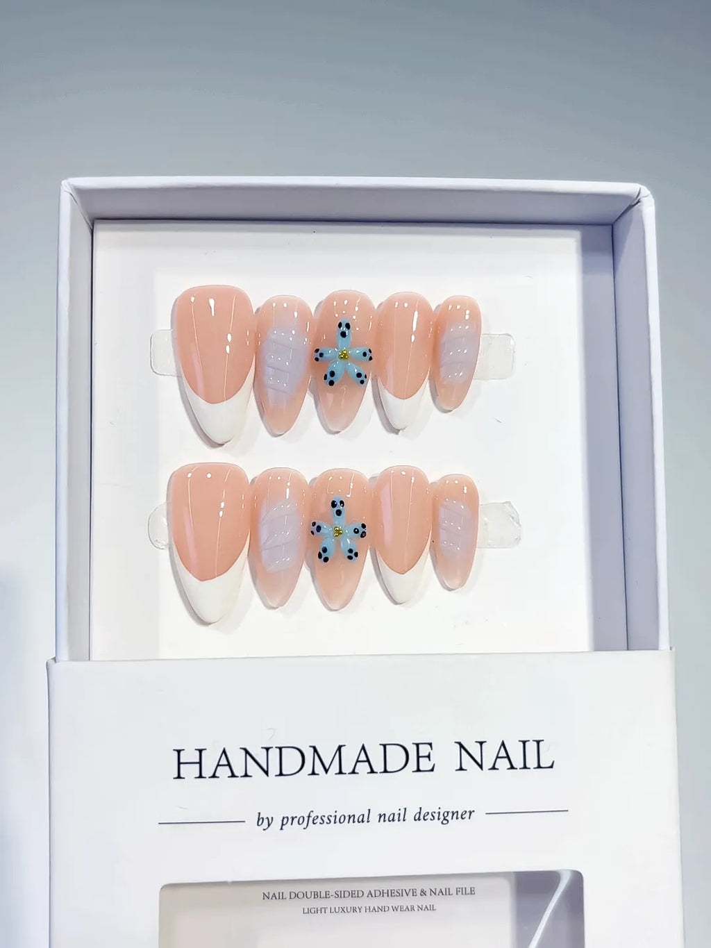 Nude White French tip Flower press on nails angled view