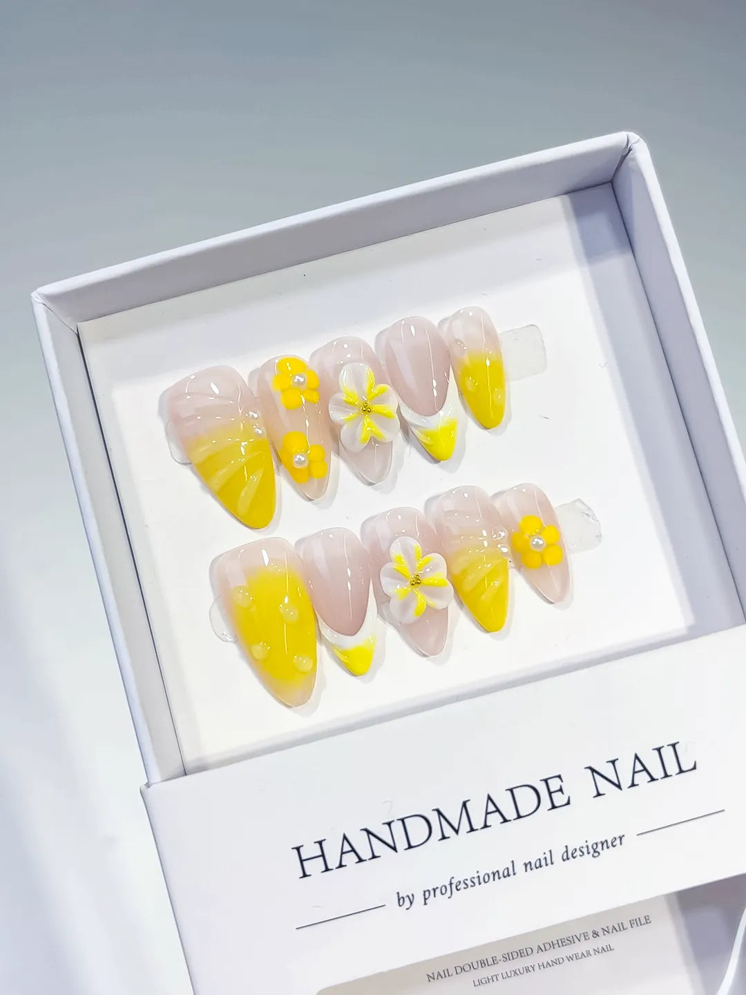 Nude Yellow French tip Flower press on nails angled view