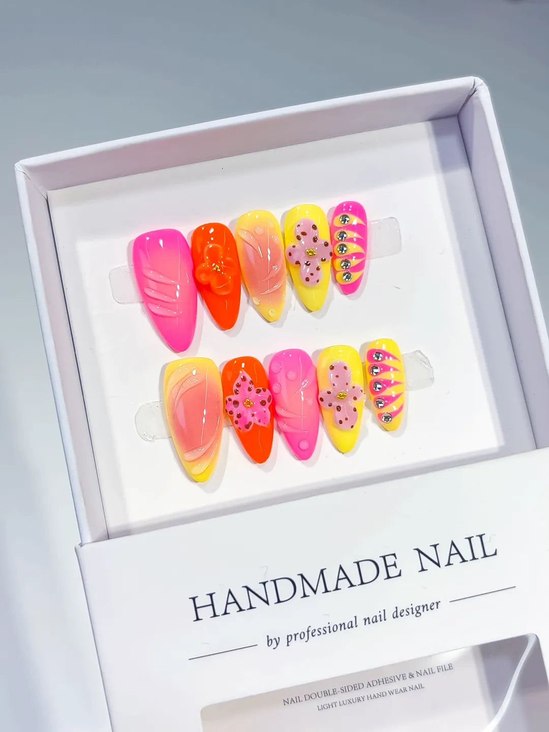 Pink Orange Yellow Abstract Flower Rhinestone press on nails angled view