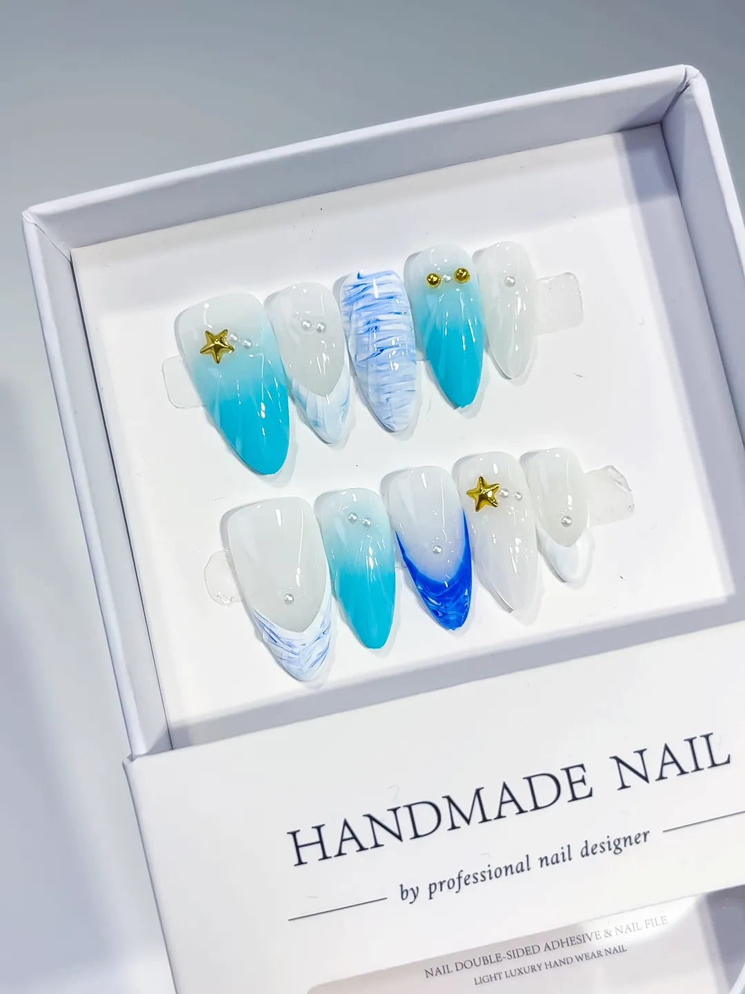 White Blue Ombre Starfish Pearl Shell press on nails angled view