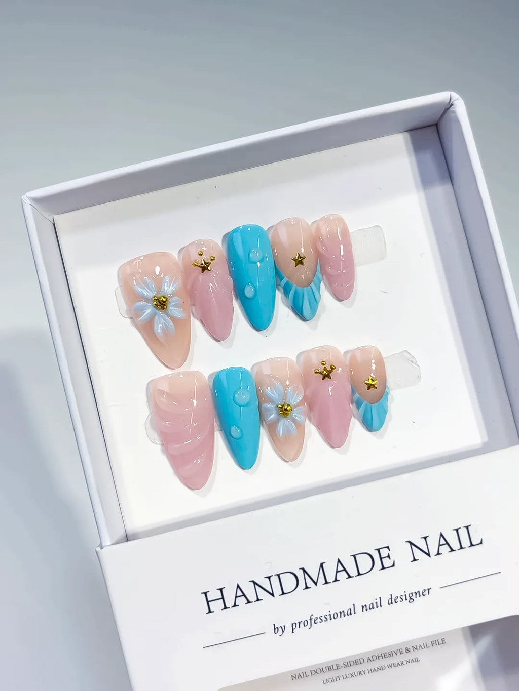Nude Pink Blue Abstract Flower Star press on nails angled view