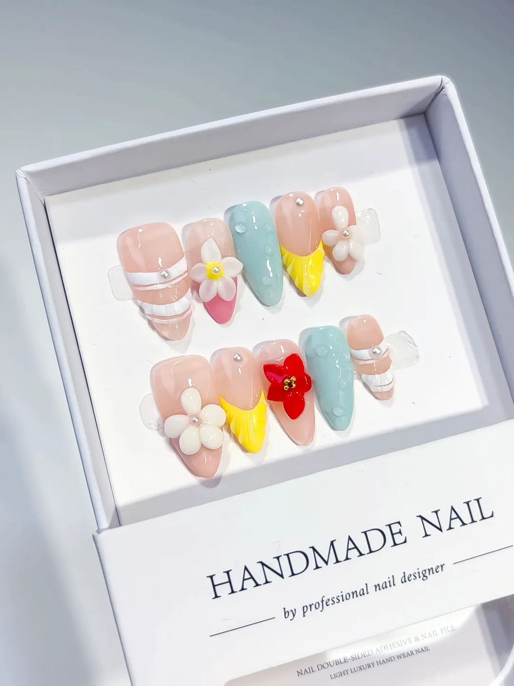 Nude Blue Yellow White Abstract Flower Pearl press on nails angled view