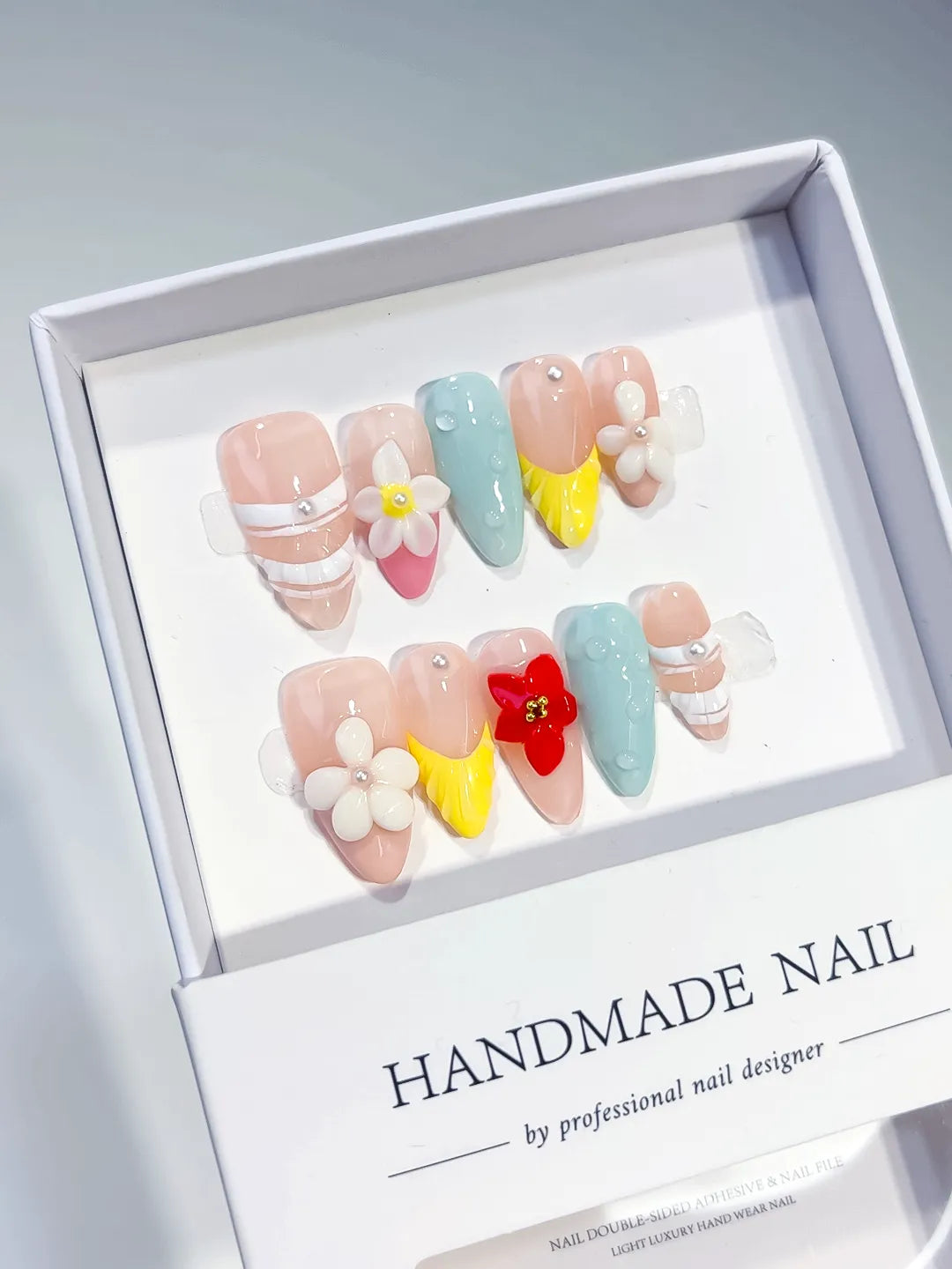 Nude Blue Yellow White Abstract Flower Pearl press on nails angled view