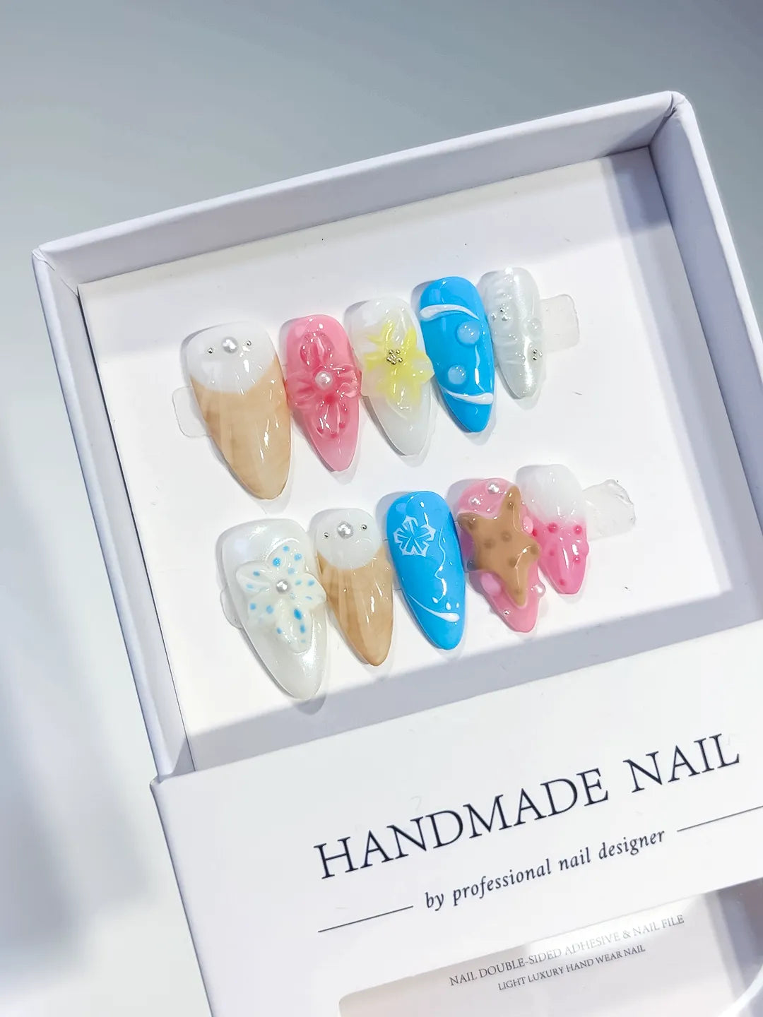 Nude Pink Blue Abstract Flower Cookie Snowflake press on nails angled view
