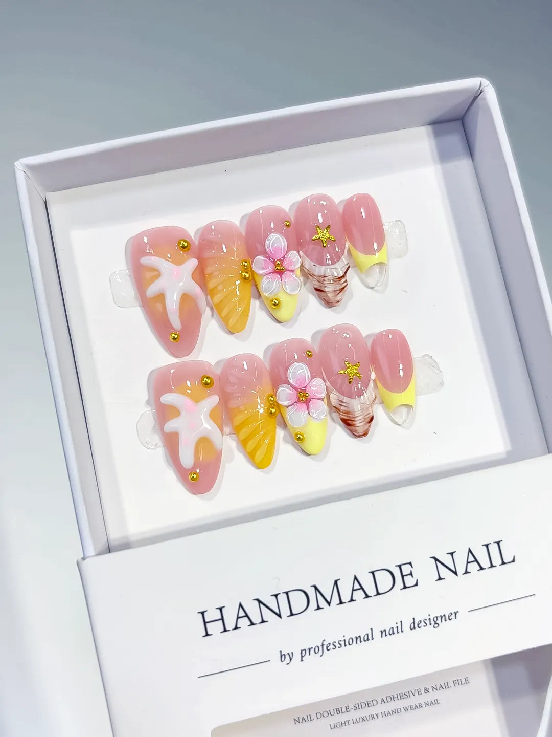 Pink Yellow White French tip Starfish Flower Shell press on nails angled view