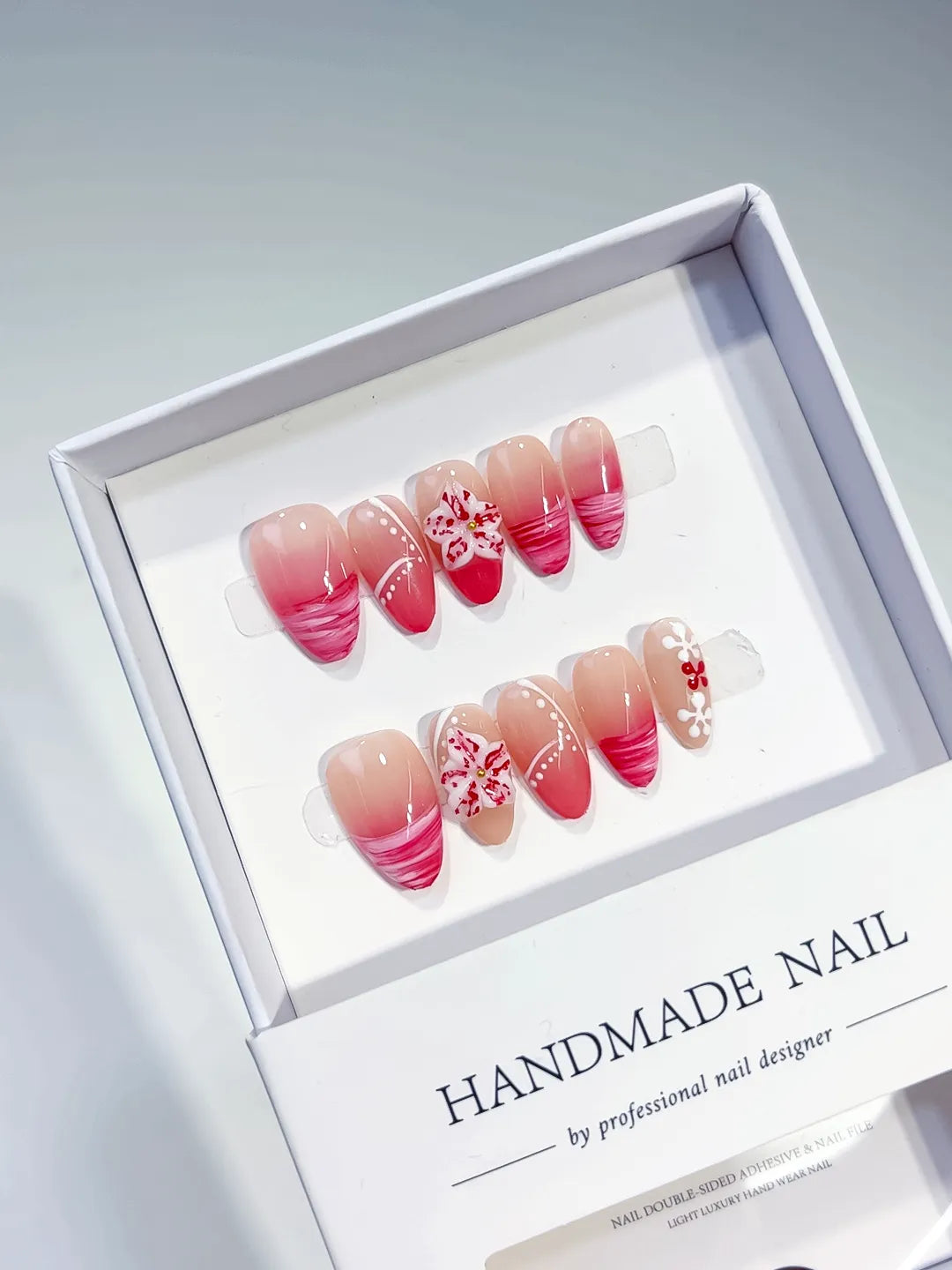 Nude Pink Red French tip Flower press on nails angled view