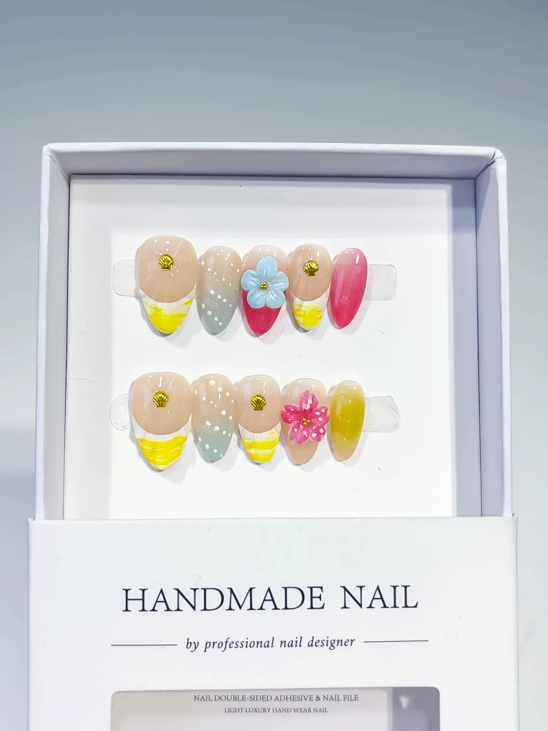 Nude Yellow Pink Green Abstract Flower Shell press on nails angled view