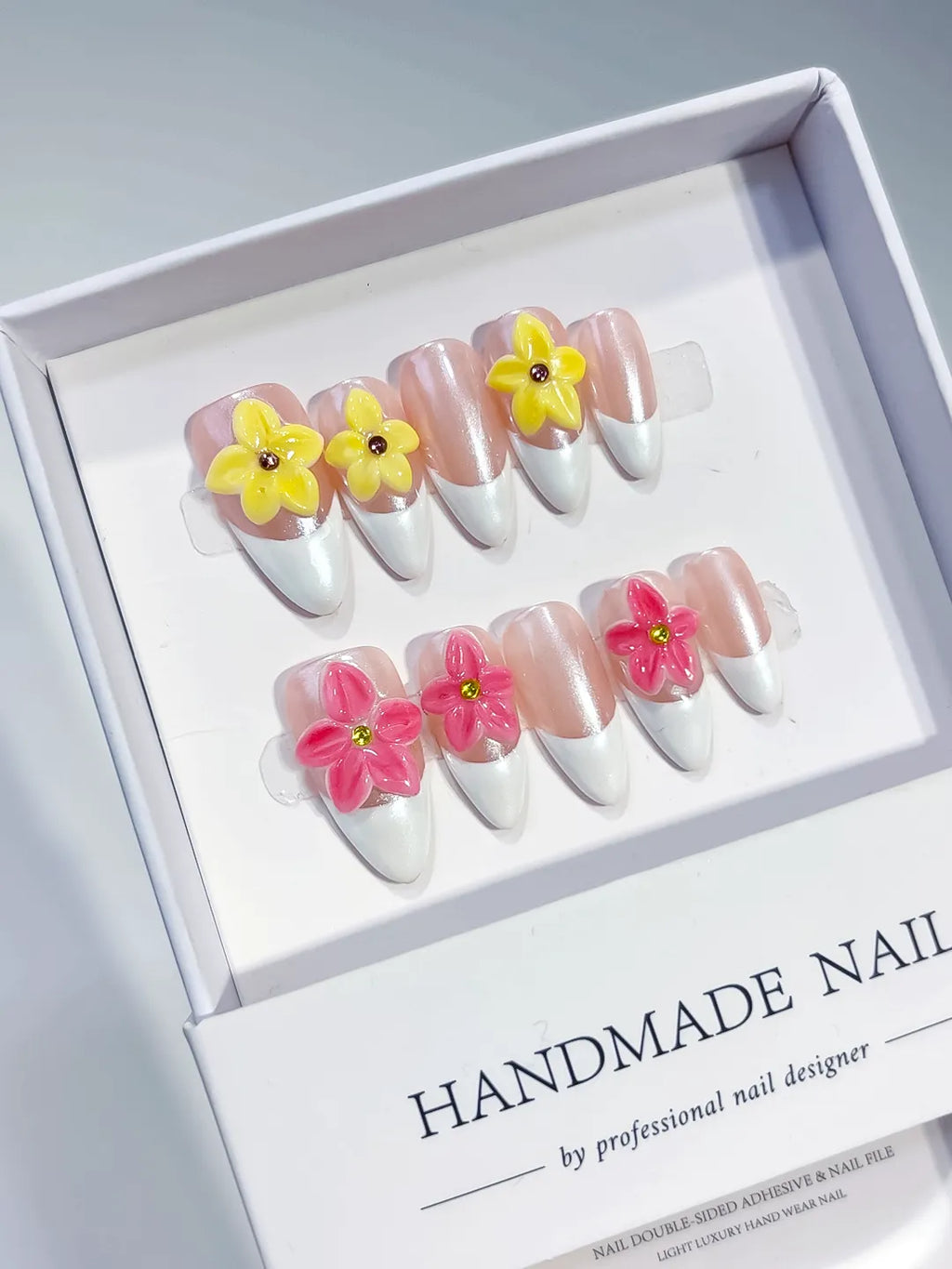 Nude White Pink Yellow French tip Flower press on nails angled view