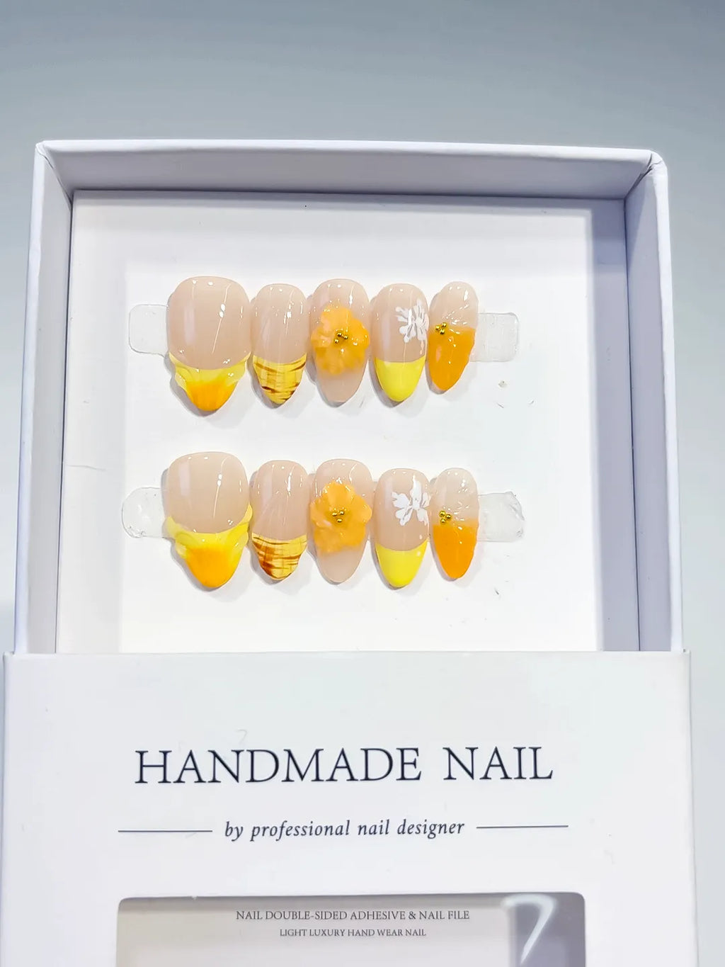 Nude Yellow Orange White French tip Flower Fruit press on nails angled view