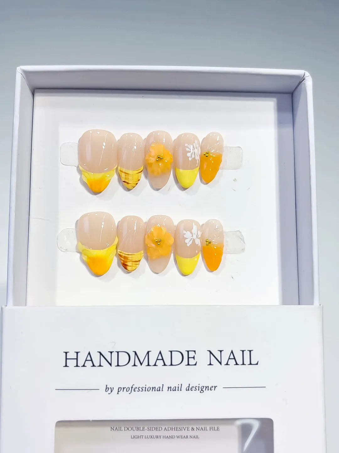 Nude Yellow Orange White French tip Flower Fruit press on nails angled view