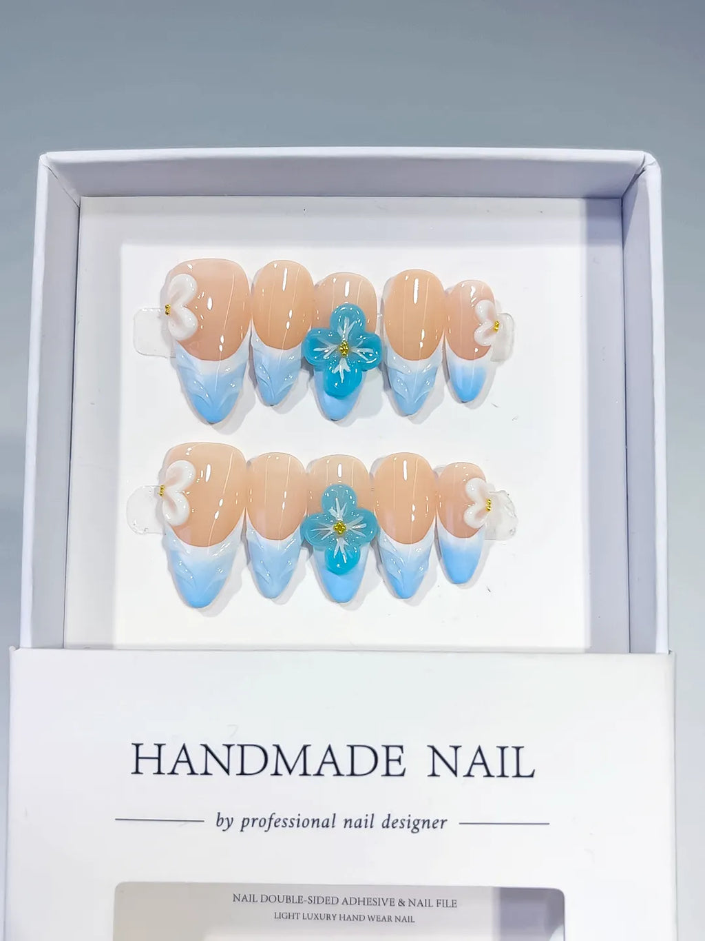 Nude Blue White French tip Flower Bow press on nails angled view