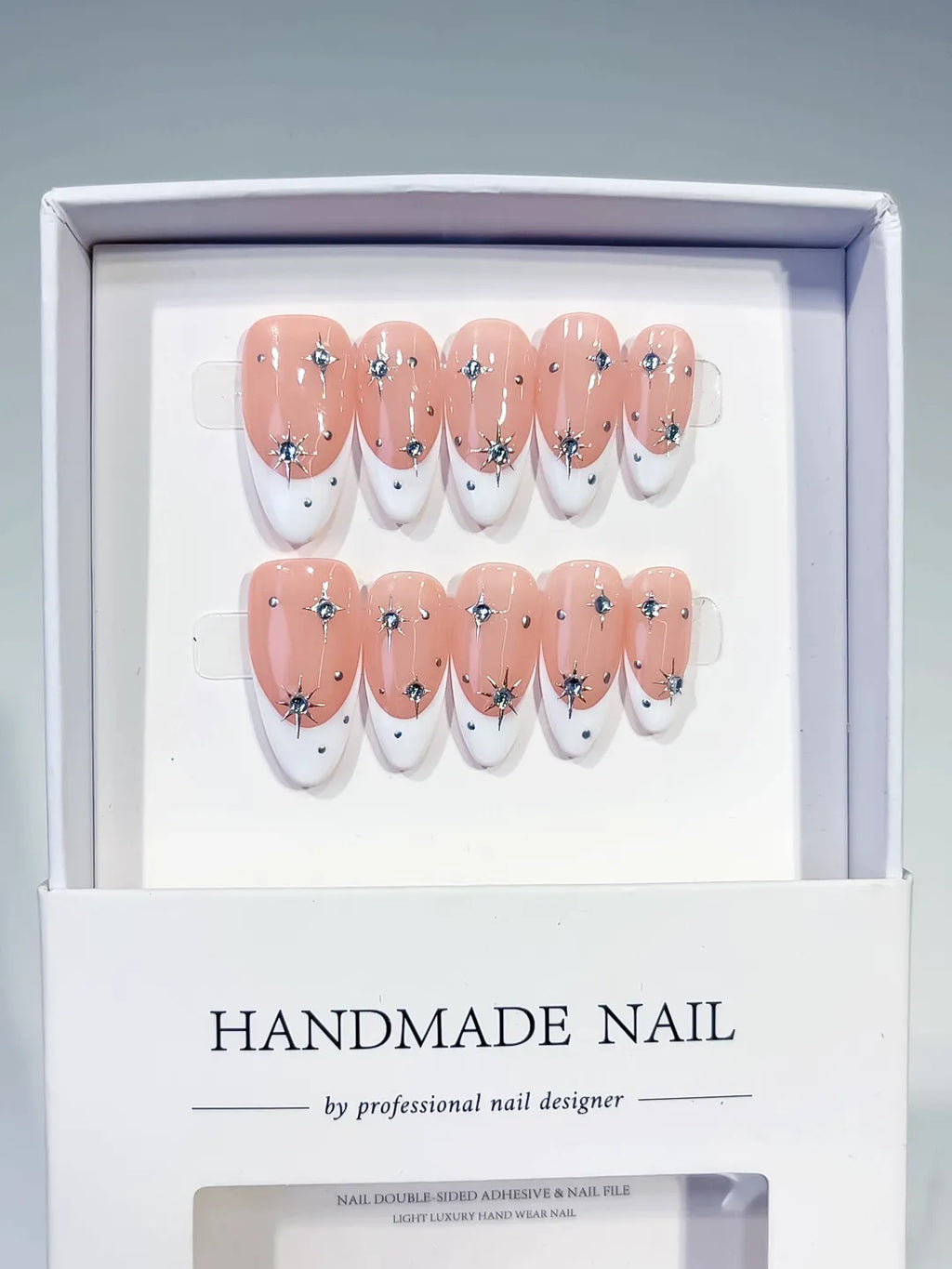 Nude White Silver French tip Star Rhinestone press on nails angled view