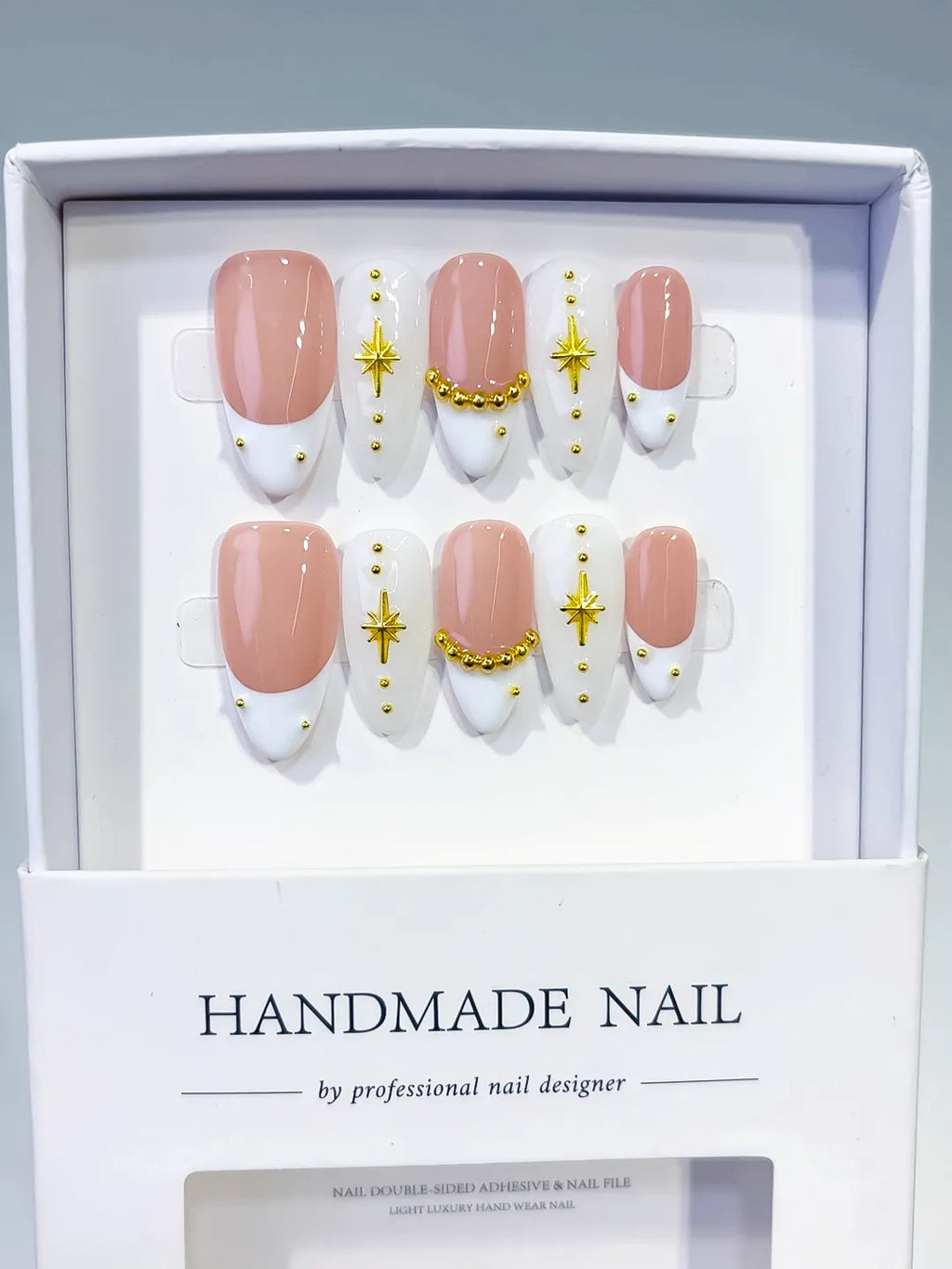 Nude White Gold French tip Star Gold Bead press on nails angled view