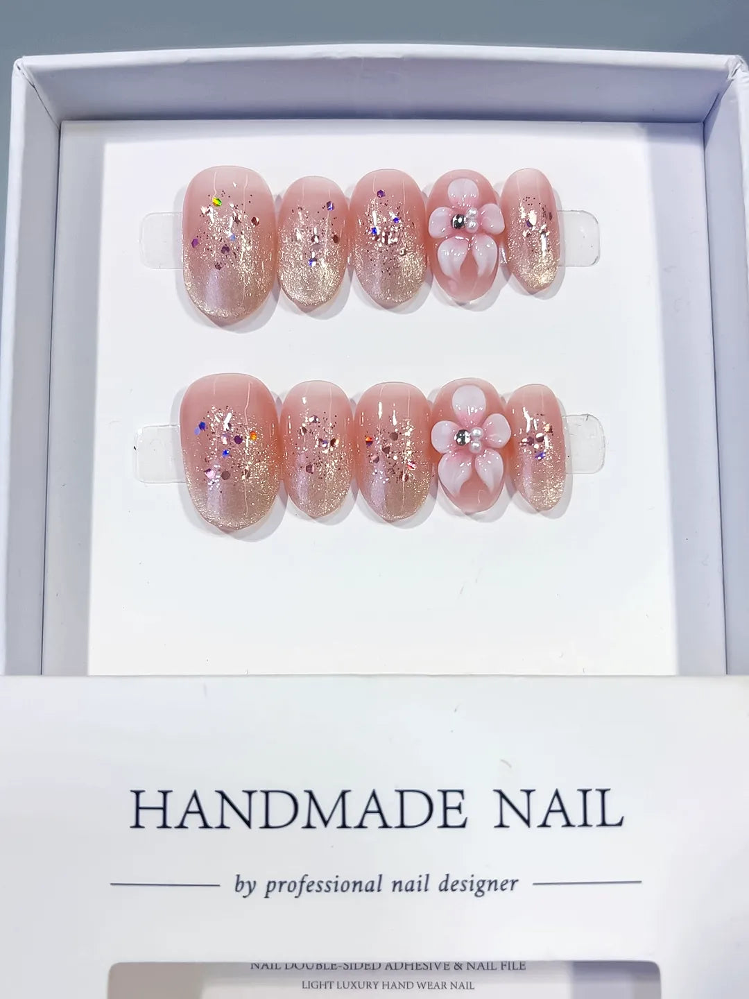 Pink Silver Glitter Flower Confetti press on nails angled view