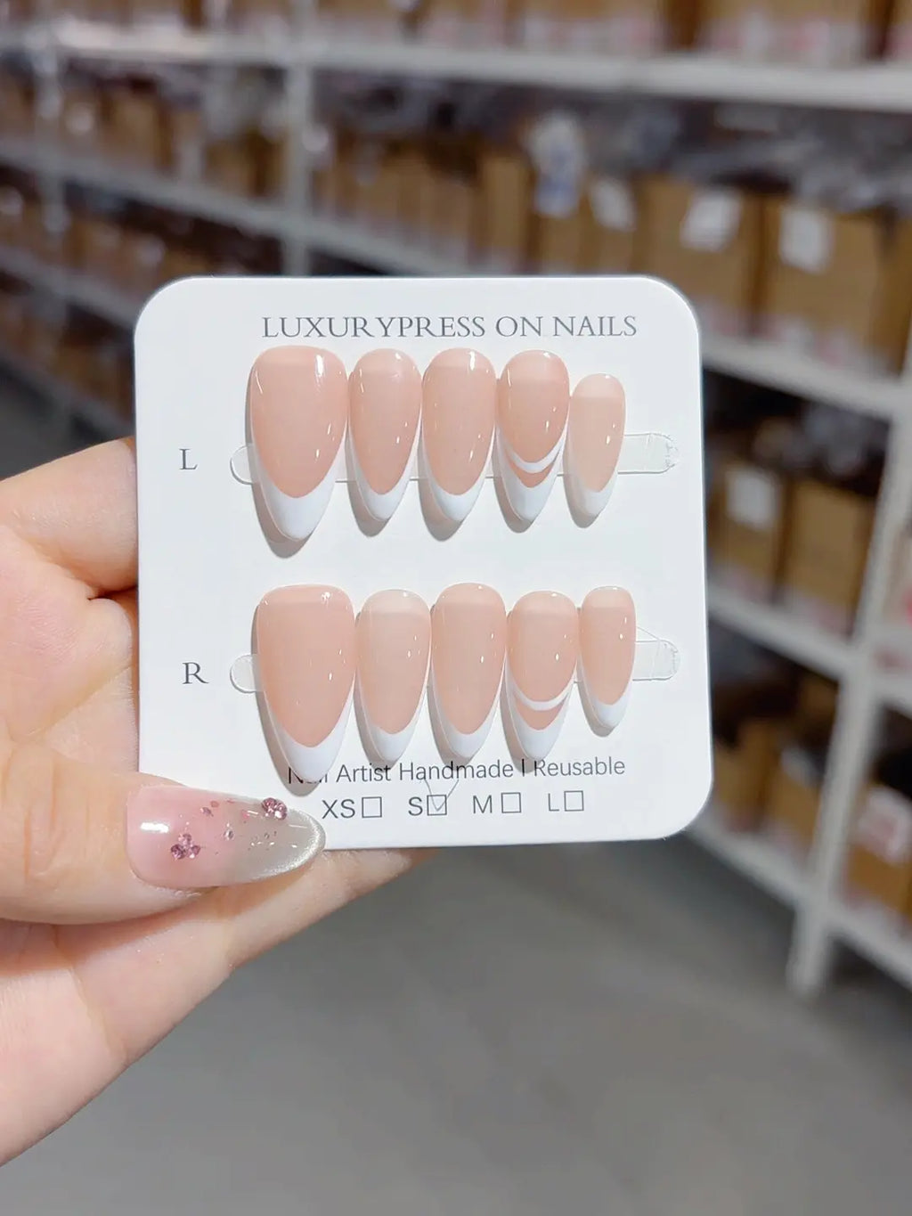 medium almond nude handmade press on nails in french tip style, full set display