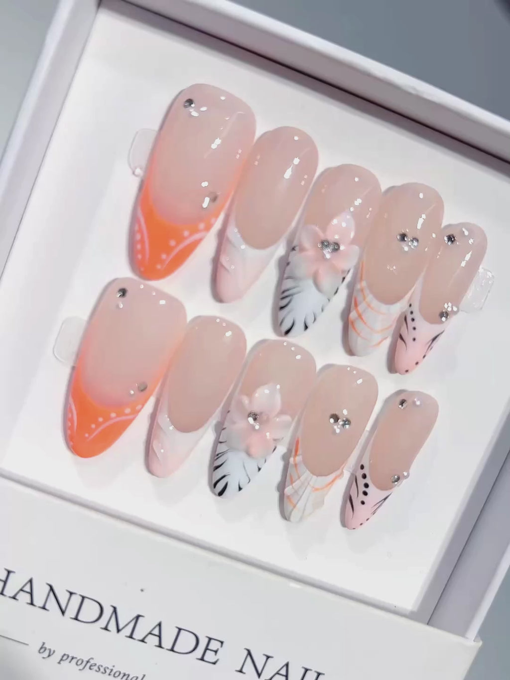 D649 - Long Nude Orange Almond French Tip Silver Line Bows - product video 1