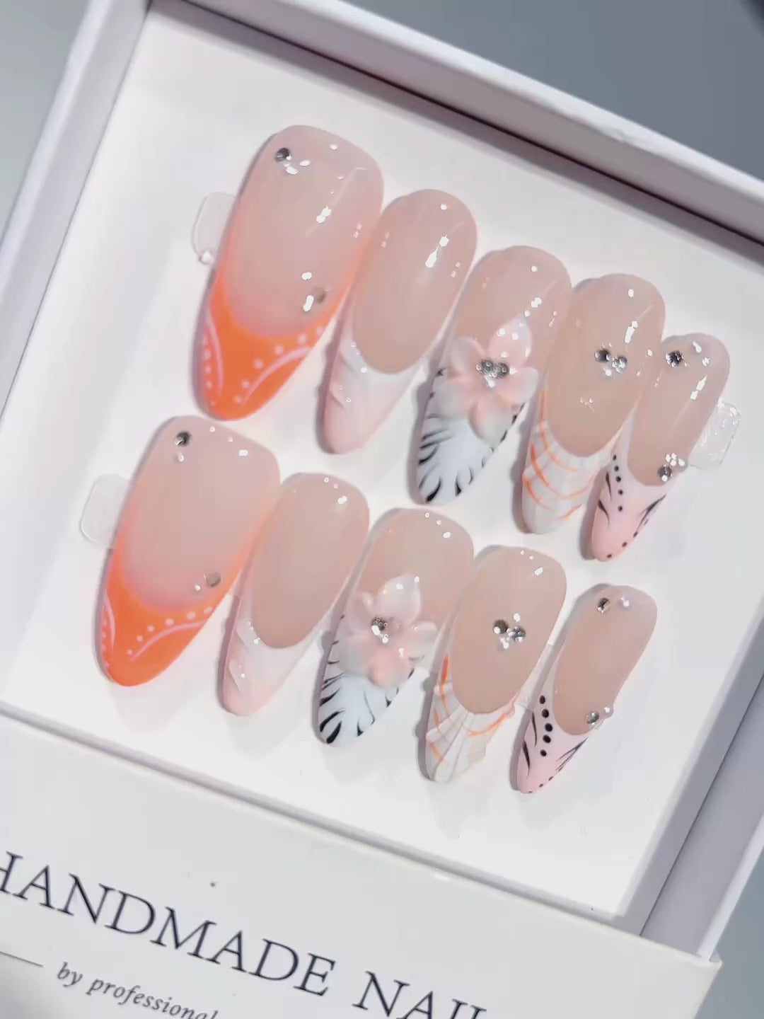 D649 - Long Nude Orange Almond French Tip Silver Line Bows - product video 1