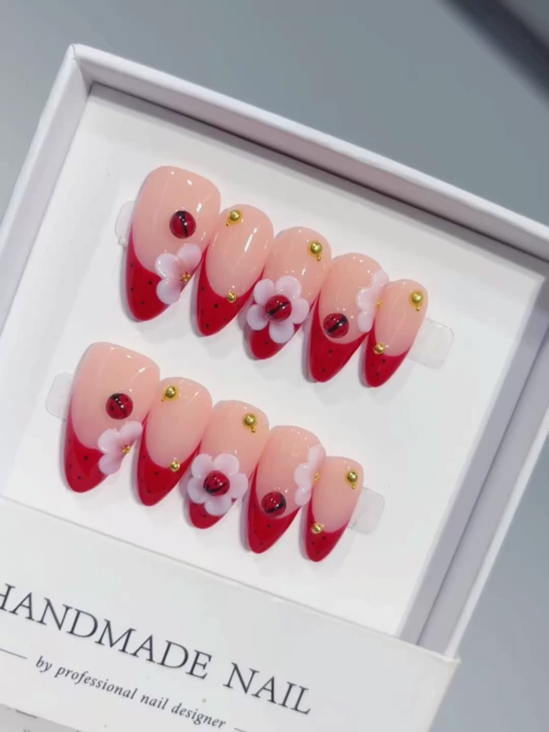 D656 - Medium Nude Red Almond French Tip Heart Flowers - product video 1